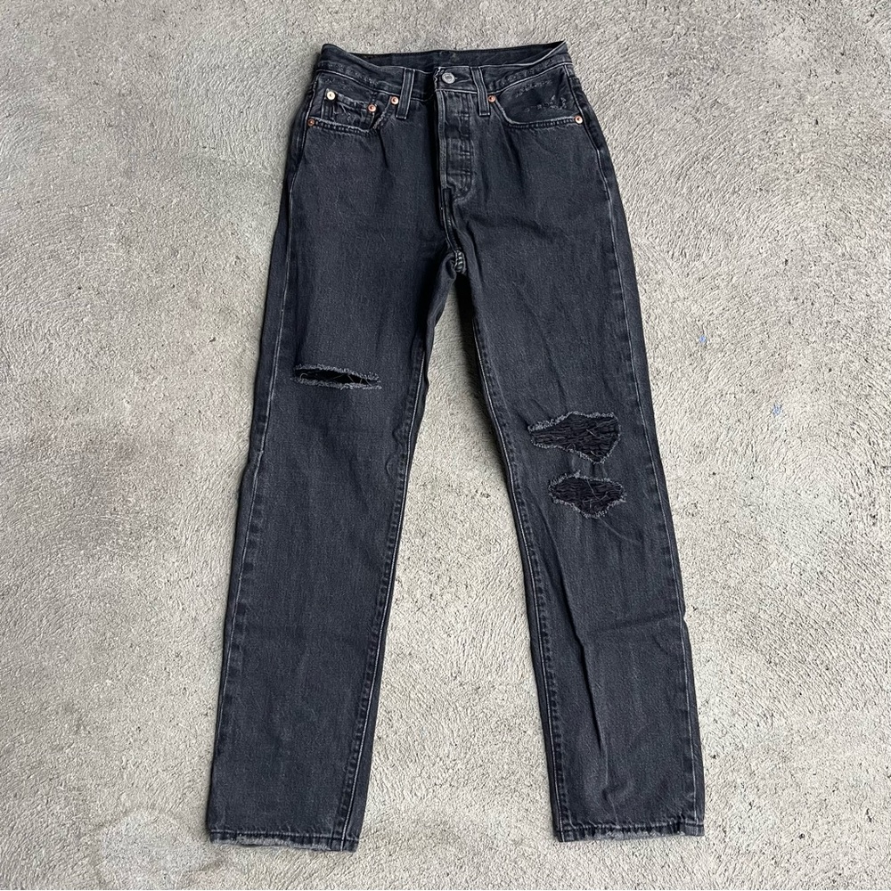 Black distressed Levi’s 501 jeans
